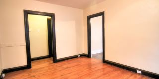 This 2 bedroom 1 bath home has been completely refinished with brilliant hardwood floors throughout! Gallery 13