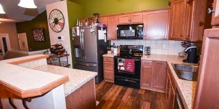 Spacious West-Side Home + 2-Car Garage + Fenced-in Yard! Available August 15th! Gallery 1
