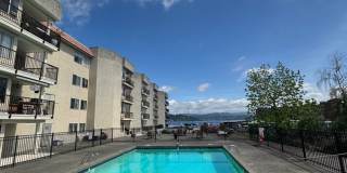Gorgeous Condo in Seward Park with 2 Parking Spaces, Steps Away from Pool with Water View! Gorgeous Condo in Seward Park with 2 Parking Spaces, Steps Away from Pool with Water View! Gallery 1