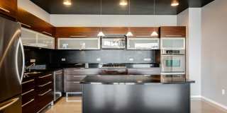 Modern Industrial Loft at Soho Lofts – 1BR/2BA High-Rise in the Arts District, City & Mountain Views! Gallery 20
