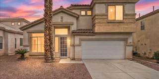 Contemporary Guard-Gated Retreat Near Rhodes Ranch Golf Club with Elegant Open-Concept Living Gallery 1