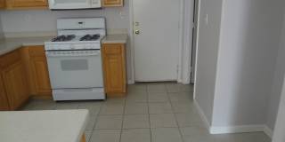 THIS 1,596 SQ. FT. HOME HAS 3 BEDROOMS, 2.5 BATHROOMS, A 2 CAR GARAGE LOCATED ON A CORNER LOT AND NEW WOOD FLOORING Gallery 3