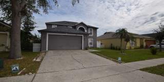This charming 4-bedroom, 2.5-bathroom single-family home for rent at 16053 Wilkinson Dr. Clermont, FL 34714 Gallery 1