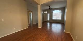 Single-level 3-bedroom home in a desirable Chandler location featuring a 2-car garage and tile roof and wood plank flooring throughout Gallery 7