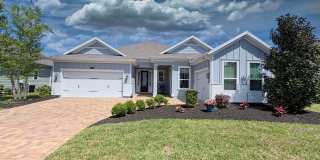 tunning lakefront home featuring 4 bedrooms 3.5 bathrooms & over 3,000 square feet of living space, plus a 3-car garage, office & attached guest house Gallery 1