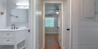 RENOVATED 2/1 w/ New Flooring/Paint, Fenced Yard, Deck, Walk In Closets, Granite Counters, & Stainless Appliances ! Avail NOW for $1295/month Gallery 21