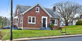 Classic 4br Cape Cod w/2 car detached Garage Gallery 1