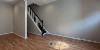 Charming 4BR/2BA Rowhouse with Hardwood-Style Flooring Throughout Gallery 12