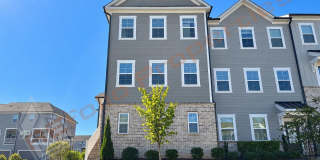 Welcome to this 4-Bedroom End-Unit Townhome with Guest Suite, 2-Car Garage & Community Pool located in Savaan Townhome, Cary, Available Now! Gallery 1