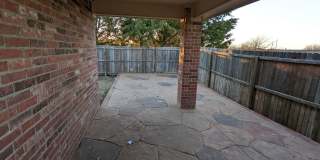 2 car garage with lighting, granite countertops. Backyard includes a custom extended concrete patio perfect for gatherings Gallery 37