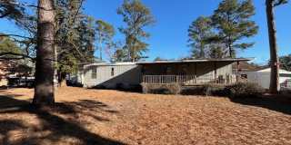 Welcome to this charming 2-bedroom, 1.5-bathroom home located in the desirable area of Leland, NC Gallery 1
