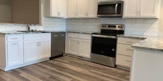Zero entry ranch townhome with 2 stall garage. Spacious 2 bedrooms with walk in closets, 2.5 bathroom, 1st floor laundry Gallery 1