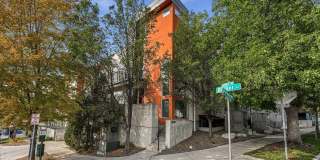 Great location with 3 sides of windows and HUGE rooftop! Gallery 1