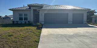 AVAILABLE MID APRIL- 4 Bedroom 2 bathroom 3 Car Garage NE Cape Coral Home with Screened Lania Gallery 1