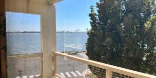 Large furnished one bedroom with spectacular water views Gallery 1