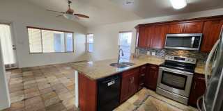 Single Story with large covered patio. Two car garage with uncovered gated parking stall. New vinyl flooring. Gallery 1