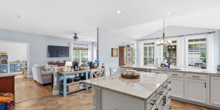 Step into a beautifully finished residence designed with an open and inviting layout that seamlessly connects each living space. Gallery 14