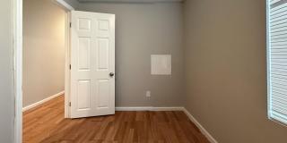 Charming 4BR/2BA Rowhouse with Hardwood-Style Flooring Throughout Gallery 3