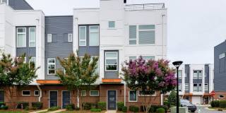 Stunning South End end unit townhome in the modern and amazing Southpoint community. Gallery 1