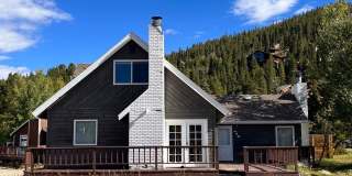 BRECK two living spaces! Fenced backyard! Bus route! Community hot tubs, pool, sauna, volleyball court, and tennis courts! Gallery 1
