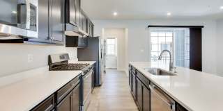 Welcome to this beautifully designed 3 level townhome in Westphalia Town Center Community! Gallery 4