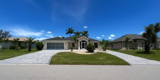 FURNISHED SHORT TERM RENTAL - 3 Bed / 2 Bath - Single Family Pool Home - $5,000/month ** Heated Swimming Pool **Canal View Gallery 1