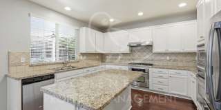 spacious 4-bedroom, 2.5-bathroom home in the desirable Whitney Ranch Gallery 12