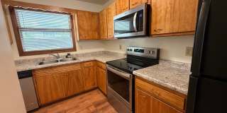 August 15th rent special! New deck! 3 Bedroom, updated kitchen, updated flooring, garage, driveway, and fenced yard - 9 month lease available! Gallery 13