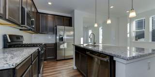 Beautiful 4 bed, 3 bath Townhome with 2 car garage ready for move in! Gallery 1
