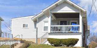 SPACIOUS 2-BEDROOM HOME WITH FINISHED BASEMENT + OFF-STREET PARKING | 15226 Gallery 1
