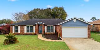 Welcome to This Beautifully Maintained 4/2 Brick Home by the Base! Gallery 1