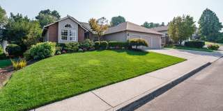 Beautifully Landscaped 1/4 acre with Well Maintained 4 bedroom 2 Bath Home with 3 Car Garage Gallery 1