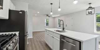 Fully renovated, 3 bed, 1 full bath, new LVP, new paint, granite counters, open floor plan, W/D hookups, must see! Gallery 9