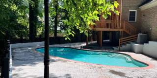 5 BR 4.5 BA home with inground heated pool and extensive hardscape! Gallery 69