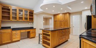 5 BR 4.5 BA home with inground heated pool and extensive hardscape! Gallery 9