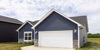 Modern Living Redefined with Stone Fireplace, Gray Cabinetry, Spa Inspired Primary Suite and Covered Outdoor Retreat Gallery 3