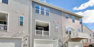 Welcome to this beautifully designed 3 level townhome in Westphalia Town Center Community! Gallery 34