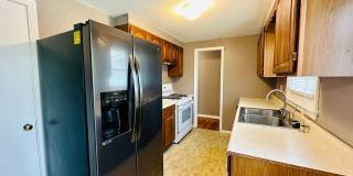{7047} Prairie Village Ranch with Hardwood Floors + Large, Fenced Yard + 1 Car Garage Gallery 9