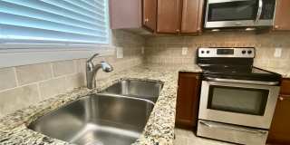 Ready 07-10-26! Great 3-bedroom home in Aragona Village! Stainless Steel Appliances, Granite Counter Tops, & Updated Baths! Gallery 16