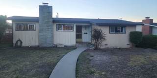 This is a spacious house featuring four bedrooms and two bathrooms, along with a two-car garage. Gallery 1