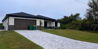 Be the first in occupy this 2025 constructed home in the vibrant city of Port Charlotte, FL! Qualify for a deposit-free option and save on move-in costs! Gallery 1