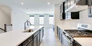 Welcome to this beautifully designed 3 level townhome in Westphalia Town Center Community! Gallery 10