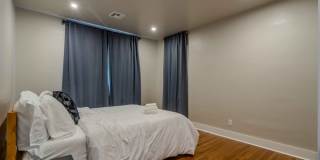 Completely remodeled like new Gingerbread midtown cottage with gleaming hardwoods, converted from a 3/1 to a 3/2. Gallery 26