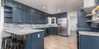 Renovated 3 Bed / 2 Bath Brick Home with 2-Car Garage & Fenced Yard in North Temple Gallery 1