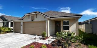 Picturesque Waterfront 4-Bedroom Home with Premium Amenities + 3 Car Garage! Community Amenities! Gallery 1