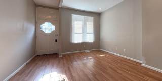Charming 4BR/2BA Rowhouse with Hardwood-Style Flooring Throughout Gallery 10