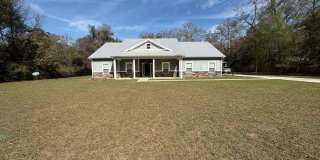 Available Now: Expansive 4BR Home with Rare 3-Bay Carport Gallery 1