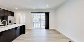 Welcome to this beautifully designed 3 level townhome in Westphalia Town Center Community! Gallery 9