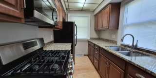 Fully fenced yard with stainless steel appliances including gas stove! Gallery 1
