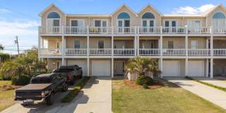 Charmed Away | Furnished 4BR/4BA Coastal Home in Kure Beach Gallery 1